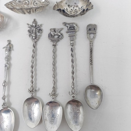 20 - A silver sifter spoon, two others, and a set of Continental silver coloured metal coffee spoons, var... 