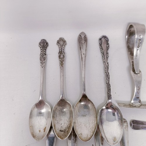 26 - A pair of silver sugar tongs, and assorted other silver spoons, various dates and marks, 8.9 ozt