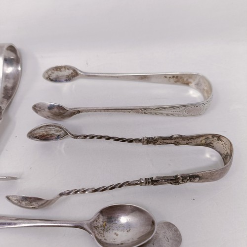 26 - A pair of silver sugar tongs, and assorted other silver spoons, various dates and marks, 8.9 ozt