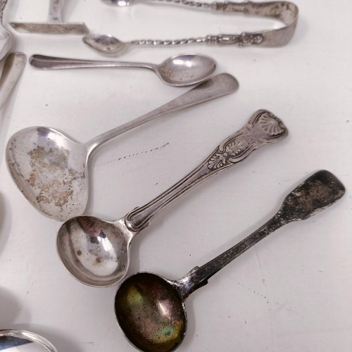 26 - A pair of silver sugar tongs, and assorted other silver spoons, various dates and marks, 8.9 ozt