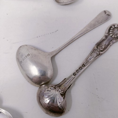 26 - A pair of silver sugar tongs, and assorted other silver spoons, various dates and marks, 8.9 ozt