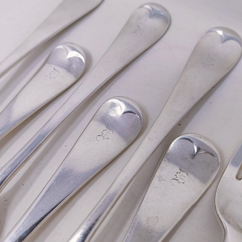 29 - A matched set of seven silver Old English pattern table forks, various dates and marks, 14.9 ozt