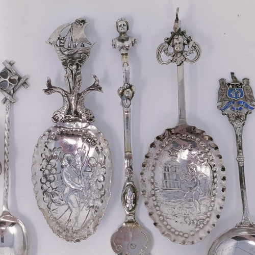 34 - A Continental silver coloured metal caddy spoon, assorted other spoons, and a knife and fork