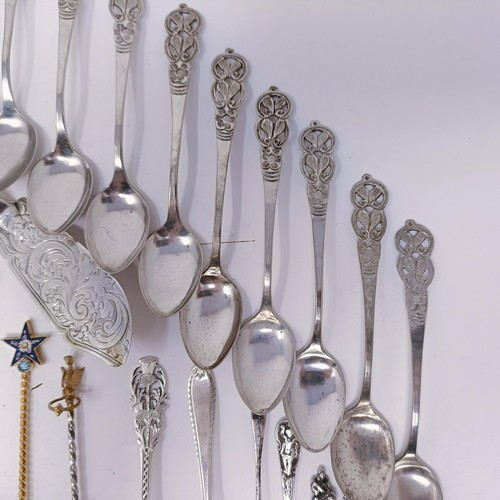 47 - A silver fiddle pattern fish knife, assorted silver and silver coloured metal spoons