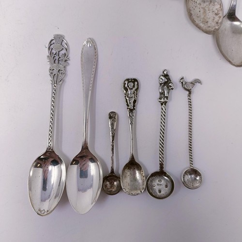 47 - A silver fiddle pattern fish knife, assorted silver and silver coloured metal spoons