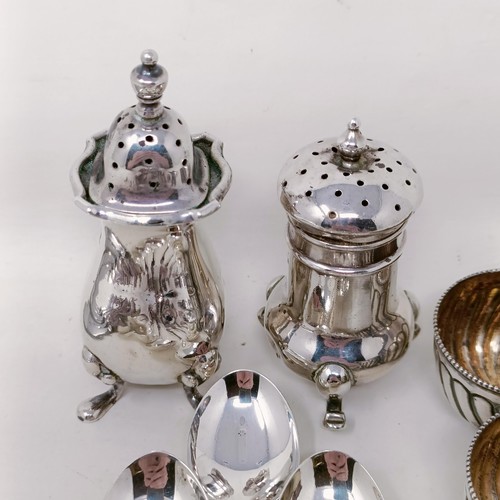 51 - Two silver pepperpots, a set of four silver salts, assorted spoons and other items, various dates an... 