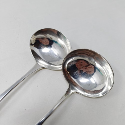 82 - A pair of late Victorian silver Old English pattern sauce ladles, Sheffield 1901, and two other sauc... 