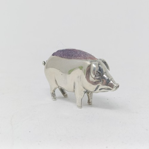 37 - A silver coloured metal pin cushion, in the form of a pig, 4 cm wide