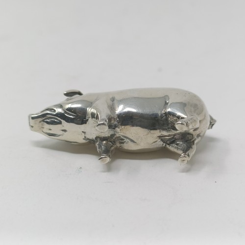 37 - A silver coloured metal pin cushion, in the form of a pig, 4 cm wide