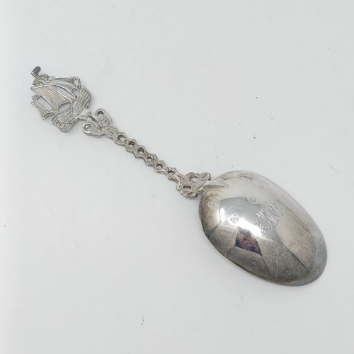 67 - A Contintenal silver coloured metal spoon, with a ship finial, a pepper pot and assorted spoons