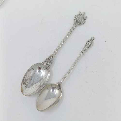 67 - A Contintenal silver coloured metal spoon, with a ship finial, a pepper pot and assorted spoons