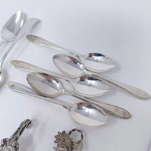 74 - A Continental silver coloured metal caddy spoon, with a goat finial, and assorted other spoons