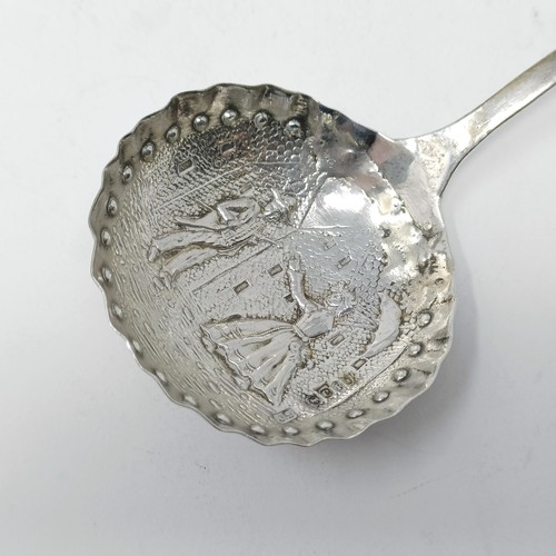 74 - A Continental silver coloured metal caddy spoon, with a goat finial, and assorted other spoons