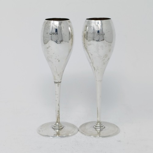 78 - A pair of silver goblets, a posy vase, a teaspoon, various dates and marks, 5.1 ozt