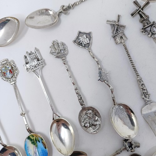 80 - A Continental silver coloured metal caddy spoon, various novelty spoons and forks, and an Indian sil... 