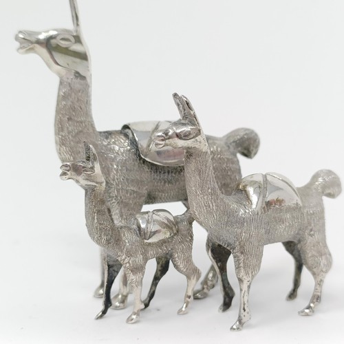 105 - A silver coloured metal llama family (3)