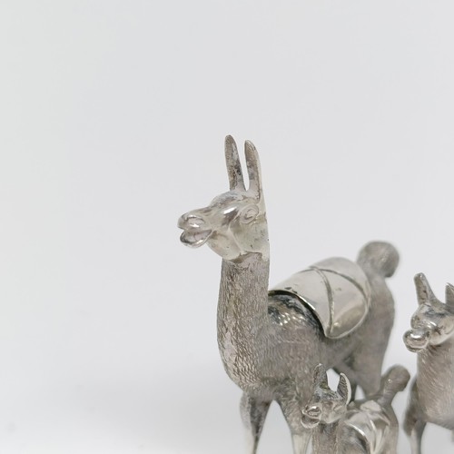 105 - A silver coloured metal llama family (3)