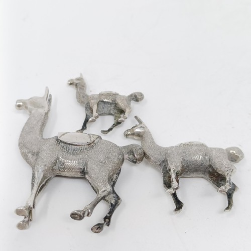 105 - A silver coloured metal llama family (3)