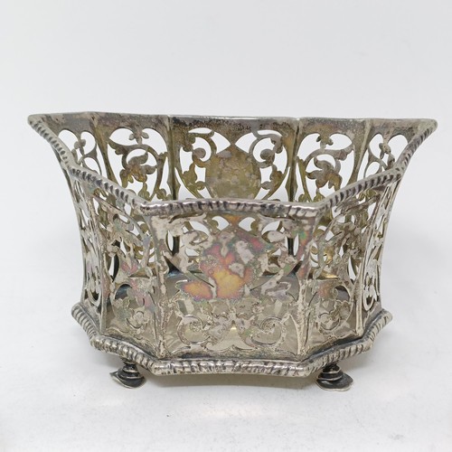 109 - A George V silver pierced bowl, a napkin ring, a  silver dish, three pairs of sugar tongs, 7.9 ozt