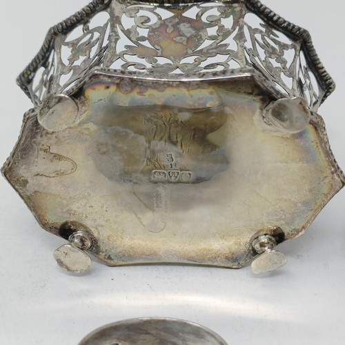 109 - A George V silver pierced bowl, a napkin ring, a  silver dish, three pairs of sugar tongs, 7.9 ozt