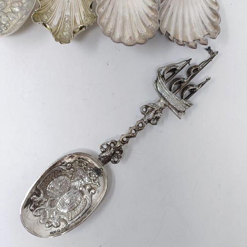 110 - A Continental silver coloured metal spoon, with a ship finial, and four other silver coloured metal ... 