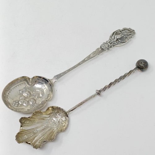 110 - A Continental silver coloured metal spoon, with a ship finial, and four other silver coloured metal ... 