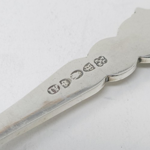 110 - A Continental silver coloured metal spoon, with a ship finial, and four other silver coloured metal ... 