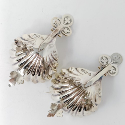 124 - A pair of Victorian silver salts, in the form of shells, Sheffield 1872, and a single salt spoon