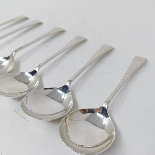 126 - A set of six Elizabeth II silver old English pattern soup spoons, and a table spoon, Sheffield 1955