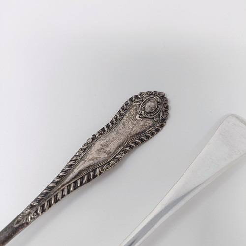 131 - A pair of George II silver fiddle pattern table spoons, two other spoons and a fork, various dates a... 