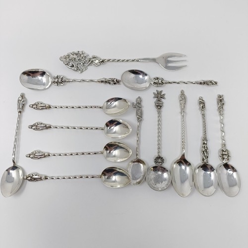 141 - A modern silver pickle fork, a silver goblet, a pepper pot, assorted silver spoons and two jewellery... 