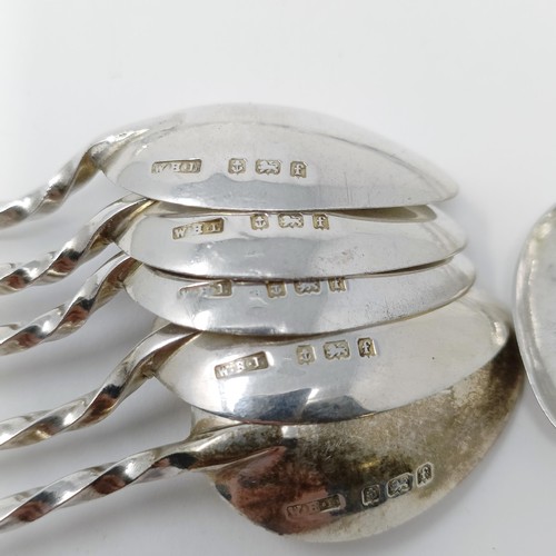 141 - A modern silver pickle fork, a silver goblet, a pepper pot, assorted silver spoons and two jewellery... 