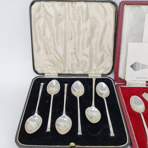 143 - A set of six George V teaspoons, and two other sets, all cased, 4.1 ozt