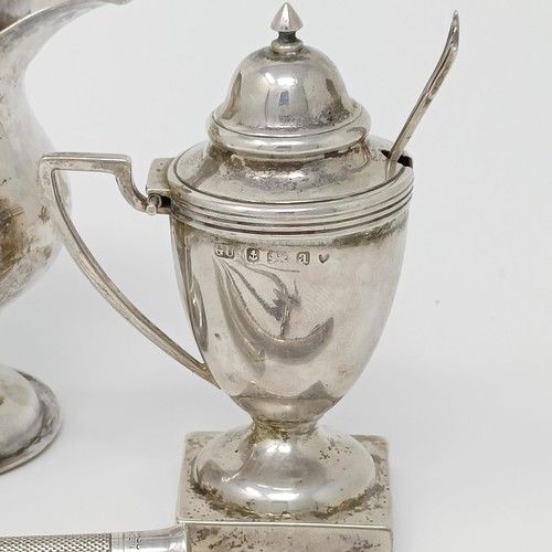 145 - A George III silver cream jug, a pair of peppers, a salt, with a blue glass liner, 4.9 ozt, two silv... 