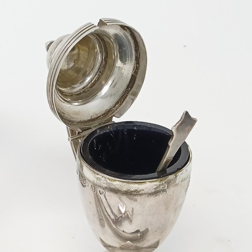 145 - A George III silver cream jug, a pair of peppers, a salt, with a blue glass liner, 4.9 ozt, two silv... 