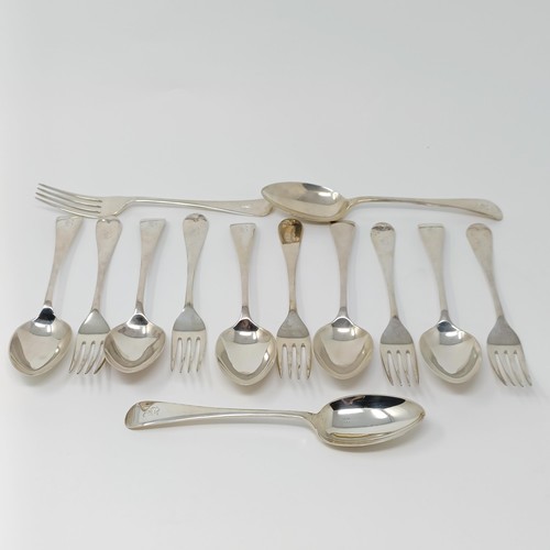 146 - A set of seven George V silver Old English pattern dessertspoons, and a set of six matching dessert ... 