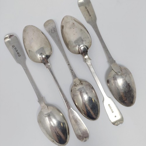 170 - A George III fiddle pattern serving spoon, four other spoons, various dates and marks, 10.2 ozt