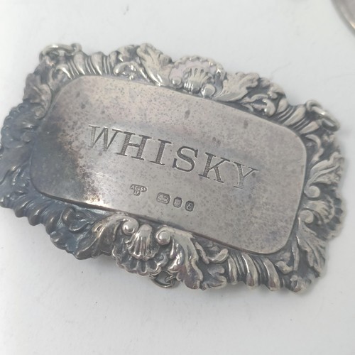 38 - A silver whisky label, five other silver spirit labels, and a silver tag, 2.5 ozt