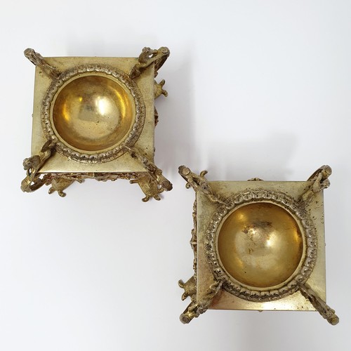 114B - A pair of Continental silver gilt salts, with pierced friezes, on scroll legs, to turtle feet, and m... 