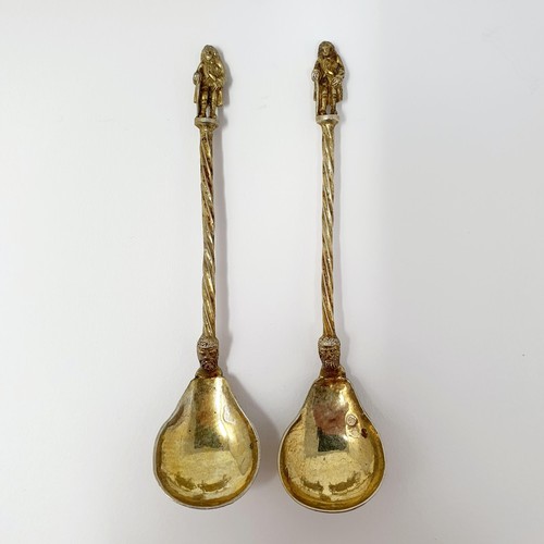 114B - A pair of Continental silver gilt salts, with pierced friezes, on scroll legs, to turtle feet, and m... 