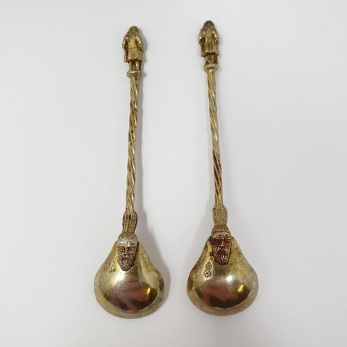 114B - A pair of Continental silver gilt salts, with pierced friezes, on scroll legs, to turtle feet, and m... 