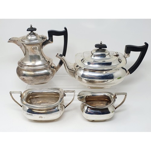 125A - A George V silver four piece tea service, with ebonised handles, Sheffield 1931, all in 51 ozt (4)