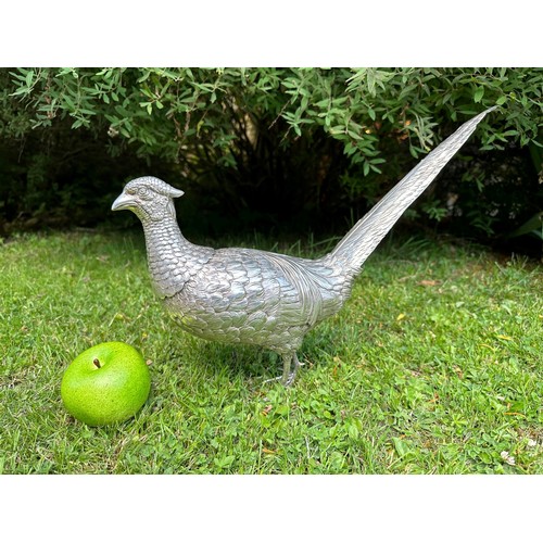 142 - A large and unusual decanter, in the form of a cock pheasant, import marks for London 1913, 33.3 ozt... 