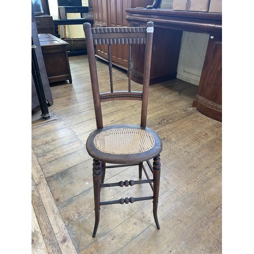 529 - An early 20th century correction chair, 99 cm high