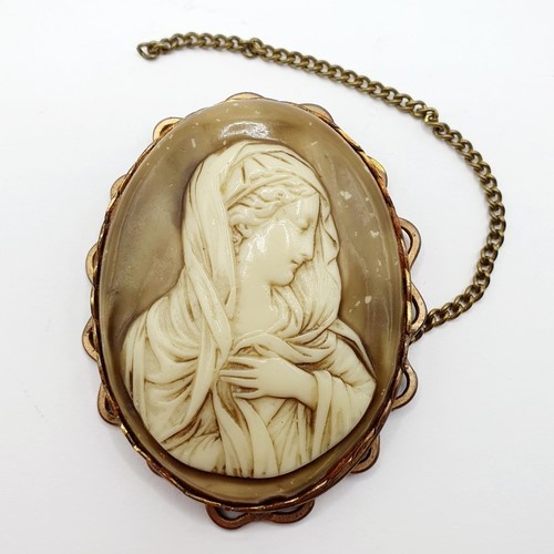 898 - A white stone star form pendant and a cameo brooch, carved a bust portrait, 7 x 6 cm