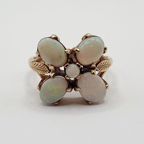 869 - A silver coloured metal pin cushion, in the form of a pig, 4 cm wide, and a 9ct gold and opal ring, ... 