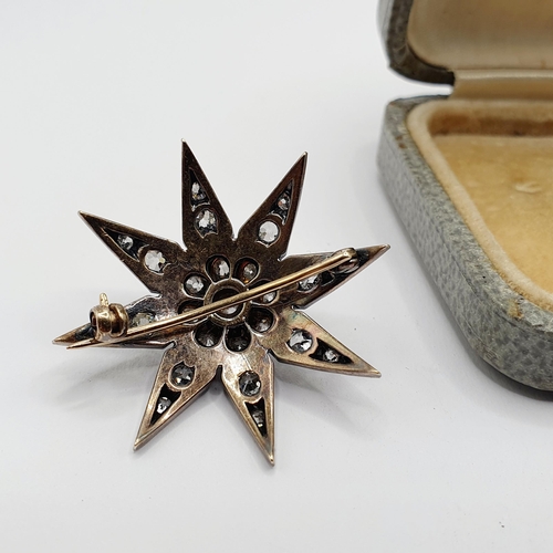 888 - A late 19th/early 20th century diamond star brooch