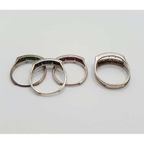 886 - A silver and white stone ring, ring size O, and three additional coloured stone rings which can be i... 