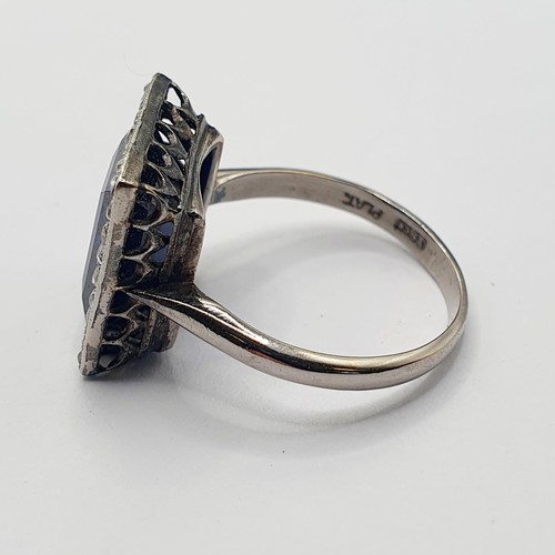 912 - An early 20th century platinum, sapphire and diamond ring, ring size N