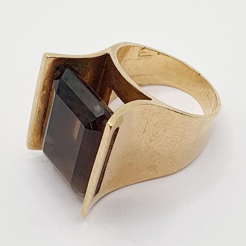 838 - A 1970s 9ct gold and brown stone dress ring, ring size Q